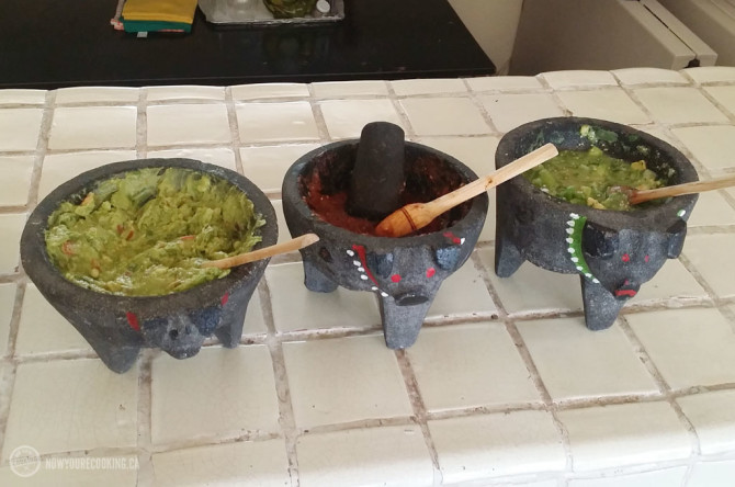 Molcajetes filled with guacamole and salsa